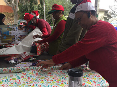 Volunteers wrapping gifts