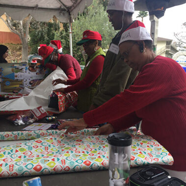 Volunteers wrapping gifts